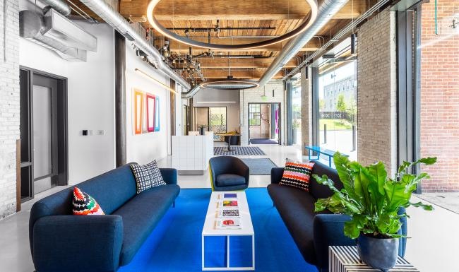 a clubroom with couches and a table