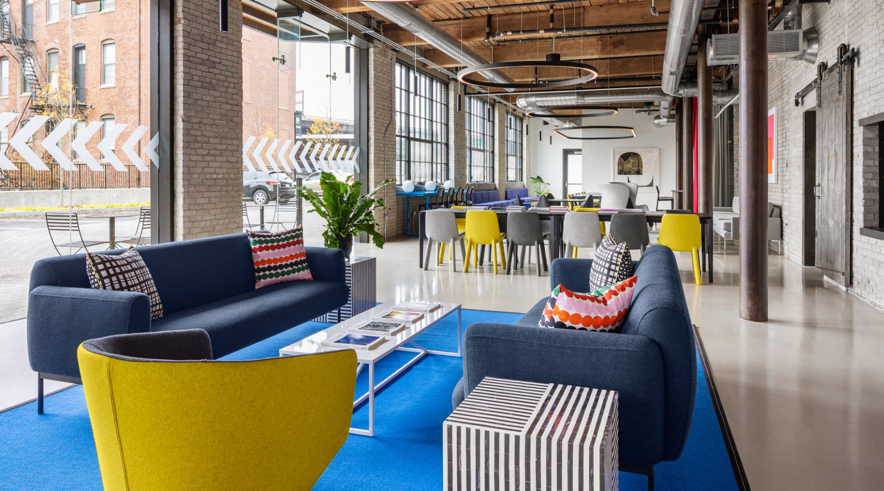 a clubroom with couches and a chair
